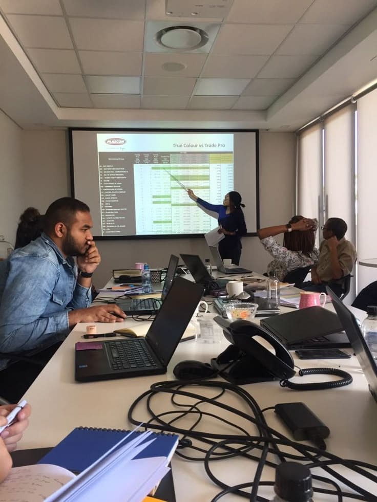 Professional working at laptop with plants